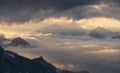 Clouds wrapping in the mountains during sunset Royalty Free Stock Photo