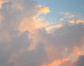 Cloudscape - Abstract Natural Background - Pattern of Yellowish Orange and Dark Cumulonimbus Clouds in Blue Sky
