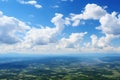 Cloudscape. Aerial view. Clouds. Blue sky background with tiny clouds. View from airplane window. Copy space.