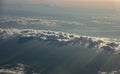 Cloudscape background at sunrise. View out of a plane window Royalty Free Stock Photo