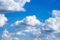 Cloudscape. Blue sky with large white clouds.