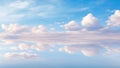 cloudscape. clouds in blue sky and reflection in sea or ocean. White cumulus clouds in sky over salt lake. mirror reflection of