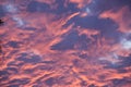 Cloudscape fire dancing in the dark stormy sunset sky