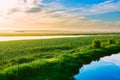 The cloudscape and grassland and water