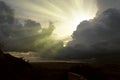 Cloudscape image of dark stormy clouds in blue sky with sun beam. The rays of the sun after the rain. Scenery with the sun`s rays Royalty Free Stock Photo