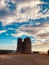 Cloudscape over the ruined bell tower, long exposure shot Royalty Free Stock Photo