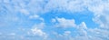 cloudscape panorama blue sky with fluffy fleecy clouds and cumulus in the middle Royalty Free Stock Photo