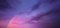 Cloudscape with rainbow on sky at sunset Royalty Free Stock Photo