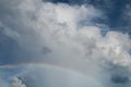 Cloudscape rainbow of natural sky with blue sky and white clouds and colorful rainbow in the sky use for wallpaper background Royalty Free Stock Photo