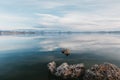 Cloudscape reflections on a Mono Lake water surface with tufa formations Royalty Free Stock Photo