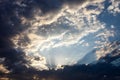 Cloudscape with the sun rays radiating from behind the cloud Royalty Free Stock Photo