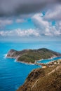 Cloudscape view of Assos village and blue sea bay. Stunning clouds above the penincula. Kefalonia island, Greece Royalty Free Stock Photo