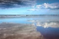 Cloudscapes reflected in wet sand on Makorori Beach, Gisborne, New Zealand