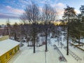 Cloudspace in a bluesky with snow covered ground through the pine tree