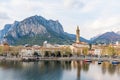 Cloudy aerial cityscape of Lecco town on spring evening. Picturesque waterfront of Lecco town located between famous Lake Como and Royalty Free Stock Photo