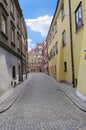 Cloudy blue sky on bright day in old town Warsaw and colorful buildings Royalty Free Stock Photo