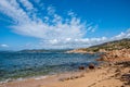 Cloudy blue sky over the sea captured from the sandy beach in summer Royalty Free Stock Photo