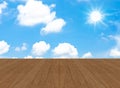 Cloudy blue sky with sun beam and wood floor Royalty Free Stock Photo