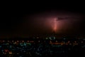 Cloudy with Bright lightning bolt strikes in the rural landscape of small city and satellite station Royalty Free Stock Photo