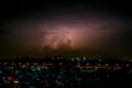 Cloudy with Bright lightning bolt strikes in the rural landscape of small city and satellite station Royalty Free Stock Photo