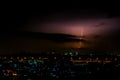 Cloudy with Bright lightning bolt strikes in the rural landscape of small city and satellite station Royalty Free Stock Photo