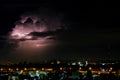 Cloudy with Bright lightning bolt strikes in the rural landscape of small city and satellite station Royalty Free Stock Photo