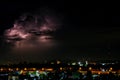 Cloudy with Bright lightning bolt strikes in the rural landscape of small city and satellite station Royalty Free Stock Photo