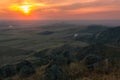 Cloudy colorful sunset over Macin Mountains