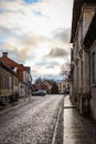 Cloudy countryside city cityscape view with brick road street