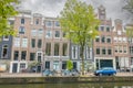 Cloudy Day in Amsterdam and Typical Buildings Royalty Free Stock Photo