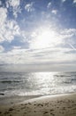 Beach sand clouds sunshine sea waves sunshine Royalty Free Stock Photo