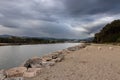 Cloudy Day at the Beach: A Serene View of Mountains and Town