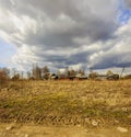 Cloudy day in early spring. Abandoned farm buildings. Russia.