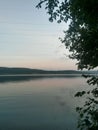 Cloudy day at the lake. water reflecting clouds Royalty Free Stock Photo