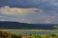 Cloudy day at the lake. water reflecting clouds Royalty Free Stock Photo