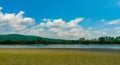Cloudy day at the lake. water reflecting clouds Royalty Free Stock Photo