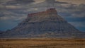 Cloudy day roadside photo of the amazing Factory Butte, Utah, USA Royalty Free Stock Photo