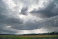 A cloudy day sky in a green hilly valley Royalty Free Stock Photo