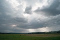 A cloudy day sky in a green hilly valley Royalty Free Stock Photo