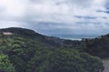 Cloudy day subtropical landscape with sea view afar