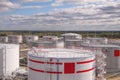 Tanks with oil for further transportation of oil through pipes at an oil refinery and oil pumping station Royalty Free Stock Photo