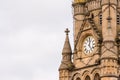 Cloudy day view gothic architecture details with clock in england