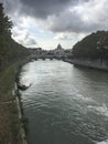 Cloudy day view of San Pietro, Saint Peter basilica, with Saint Angelo bridge and Tevere river Royalty Free Stock Photo