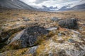 Cloudy day in the wild, remote arctic valley of Akshayuk Pass, Baffin Island, Canada. Iconic granite mountains on the