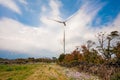 Cloudy evening landscape with two windgenerator at a coast in Jeju Island, Korea. Royalty Free Stock Photo