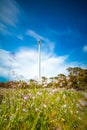 Cloudy evening landscape with two windgenerator at a coast in Jeju Island, Korea. Royalty Free Stock Photo