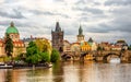 Cloudy evening in Prague old town, view at the Charles Bridge over Moldava river Royalty Free Stock Photo