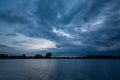 Cloudy evening sky over a calm lake Royalty Free Stock Photo