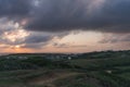 Cloudy evening sky. Sunset. Hilly terrain Royalty Free Stock Photo