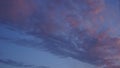 Cloudy evening sky where the clouds are colored by the setting sun Royalty Free Stock Photo